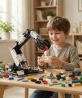 STEM educational remote-control robotic arm kit (Amazon); white and black modular arm with controller on a table