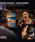 DT 770 Pro X Wired Studio Headphones 48 Ohm Closed Back For Recording And Mixing worn by two people and displayed in close-up.