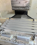 Badass Straight Up Heavy Duty 6061 Anodized Aluminum T Slot Plate Fixturing Table For CNC Milling with parts mounted.