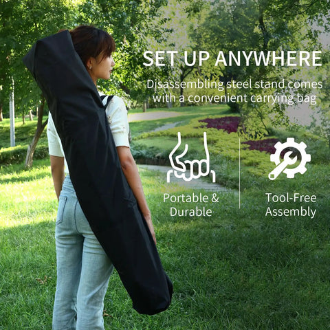 Person carrying 2 In 1 Hammock With Stand Portable Hammock And Swing Chair No Tools Assembly Carry Bag in a garden