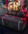 Road Ready Drum Hardware Case With Wheels And Telescoping Handle Featuring Hella Durable Roto Molded Polyethylene Construction Secure Cinch Straps For Stands Pedals And Gear Hauling Black in a performance setting.