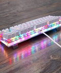 Legit Wired Gaming Keyboard With Hella Smooth Mechanical Feel And Straight Fire RGB Rainbow Backlight Featuring Nine Custom Lighting Modes Plus Six Key N Key Rollover And Multimedia Keys For Ultimate Windows Pc Gaming Setup on a wooden surface.