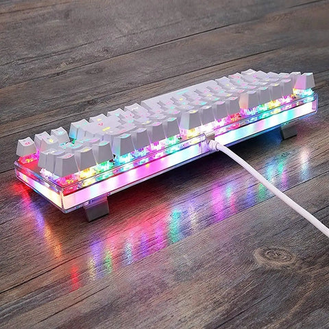 Legit Wired Gaming Keyboard With Hella Smooth Mechanical Feel And Straight Fire RGB Rainbow Backlight Featuring Nine Custom Lighting Modes Plus Six Key N Key Rollover And Multimedia Keys For Ultimate Windows Pc Gaming Setup on a wooden surface.