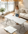 Woman setting up Six Foot Folding Camping Table With 350 Lb Capacity Portable Outdoor Picnic Desk in living room, 71 x 29 inches
