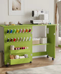 Slick Fold Up Sewing Table With Built In Charging Port And Smooth Rolling Lockable Wheels Nifty Storage Trays Pegs And Deep Bin, green color, organized with thread spools and craft supplies.