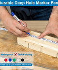 Person using Ten Pack Pro Grade Long Nib Marker With 20mm Nib For Deep Hole Marking Waterproof Construction Pen on wood
