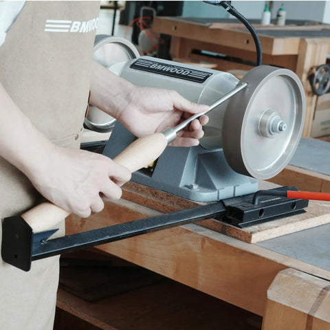 Total No Sweat Setup For Your Shop This Upgraded Grinding Jig System Cranks Out Razor Sharp Edges On Wood Chisels Turning Tools And Bowl Gouges Using Standard Eight Inch Grinders, showing precise sharpening on a grinding wheel.