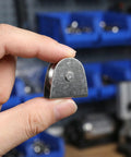 Heavy Duty V Groove Pulley Wheel 304 Stainless Steel Flagpole Riser Kit held in hand, showcasing smooth glide design.