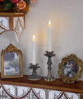 Two 7.5 inch ivory LED window candles, flameless with a flickering effect, in ornate holders, showcasing a safe home decor vibe.