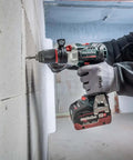 Premium 18V Brushless Cordless Hammer Drill Driver Featuring A Beefy Half Inch Quick Swap Chuck And Smart Torque Control To Rattle Off Stripped Bolts Like A Boss While Crushing Concrete Tasks Tool Only drilling into a concrete wall.