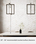 Woodburn One Light Pendant Light In Brushed Nickel Dimmable Modern Rectangle Fixture hanging over kitchen table