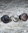 Oil Rubbed Bronze Cabinet Knobs One And One Quarter Inch Round Drawer Handles Pack Of Forty Everyday Durable Kitchen Cabinet Hardware For Cabinets, Dressers And Home Projects Includes Free One Inch And One And Three Quarter Inch Lengths on a granite surface, displaying three different finishes.