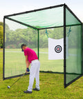 Man practicing swing with Indoor Golf Enclosure 11x8ft Heavy Duty Net With HD Dual-Layer Impact Screen in outdoor setting.