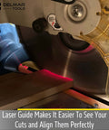 Delmar Tools miter saw laser guide installed on a portable saw; bright red laser line marks wood for precise cuts.