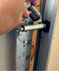 Applying All-In-One 5oz Synthetic Ester Lubricant Spray With Precision Needle for Door Hinges on a garage door hinge