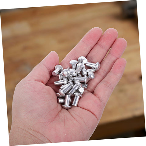 200 Pcs Solid Aluminum Dome Head Rivets M5x10 for DIY projects held in a hand, showcasing durable fastening solutions.