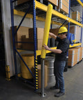 Hecka Sturdy Low Density Polyethylene Bollard Post Cover Slides On With Zero Sweat shields a concrete post in a warehouse.
