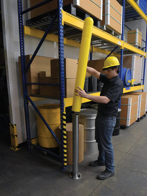 Hecka Sturdy Low Density Polyethylene Bollard Post Cover Slides On With Zero Sweat shields a concrete post in a warehouse.