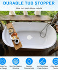 M METERXITY 4-Pack 5.9 in Silicone Tub Stopper, Bathtub Drain Stopper in a stylish bathtub with a wooden tray.
