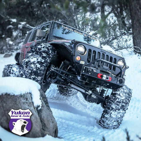 Off-road jeep with Yukon Gear, featuring Drop In Replacement Open 44 Differential Spider Gear Kit With 30 Spline Axles