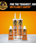 Front view of four Gorilla 100% silicone sealant cartridges and bottles; orange labels, white nozzles; clear sealant.