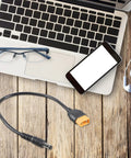 Male to DC5.5x2.1mm or 2.5mm 5A Charging Cable 20AWG with laptop and smartphone on wooden surface