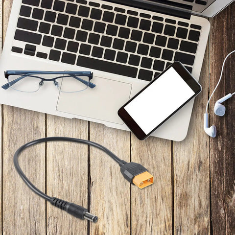 Male to DC5.5x2.1mm or 2.5mm 5A Charging Cable 20AWG with laptop and smartphone on wooden surface