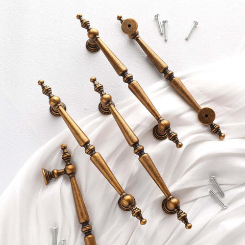 Get The Look You Want With These Super Stylish Vintage Antique Brass Cabinet Pulls That Have 5 Inch Hole Centers displayed with screws