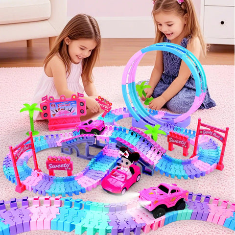 Girls playing with Pink 177 Piece Flexible Track Car Toy Set with 360° rotating tracks, princess car, doll, bridges, and coconut trees.