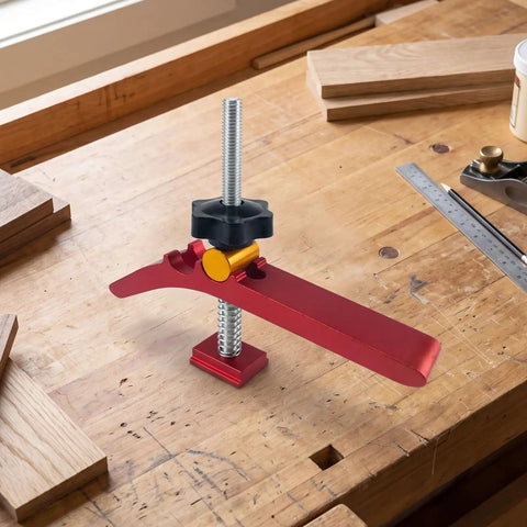Hilitand T Track Hold Down Clamp Is The Real Deal For Adjustable Metal Clamps on a workbench gripping wooden boards.