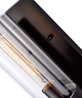 Close-up of Black Indoor Wall Sconce Light Fixture With Cylinder Glass Over Mirror for Vanity Bedroom Kitchen Sink