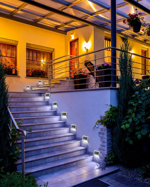 Solar Powered Outdoor Fence Lights 24 Pack Waterproof Stainless Steel Deck And Stair Lamps illuminating outdoor stairs at night