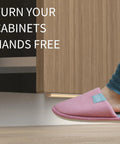 Person using Trash Cabinet Foot Pull Hands Free Foot Pedal Opener for Drawers Bins and Cabinets in a modern kitchen.