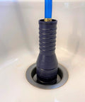 VIP2 Drain Unclogging Kit For 1.5 To 3 Inch Kitchen Drains in action with water powered cleaner inserted in sink drain