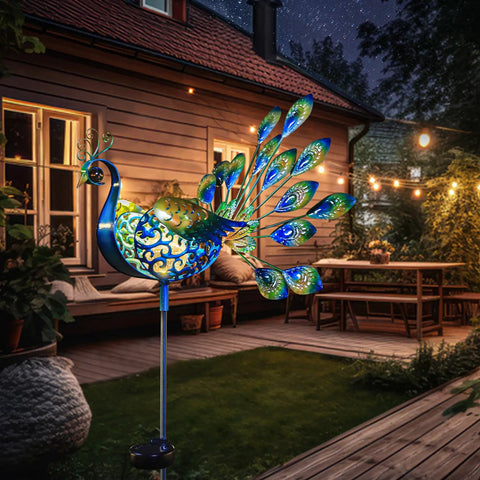 Peacock Solar Garden Stake Lights For Pathways And Backyard Decor Metal Outdoor Lights illuminating patio at night