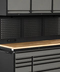 Top Tier 72 Inch Rolling Tool Chest 79 Inches Tall features black pegboard backing and wooden countertop for garage organization.