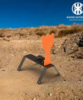 Orange AR500 Steel Auto Reset Target Thirteen Inch Popper Three Eighths Inch Self Reset Gong Target For Pistol Rifle Handgun Shotgun Rimfire Practice Range Ready on dirt platform.
