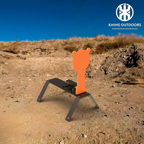 Orange AR500 Steel Auto Reset Target Thirteen Inch Popper Three Eighths Inch Self Reset Gong Target For Pistol Rifle Handgun Shotgun Rimfire Practice Range Ready on dirt platform.