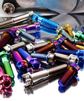 Colorful assortment of Pack Of 4 Grade 5 Titanium Torx Bolts M10 X 1.25 Pitch Brake Caliper Screws in various lengths.