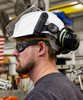Worker wearing MX350 Clear Anti Fog Safety Eyewear with gas resistant neoprene strap and brow guard, in an industrial setting.