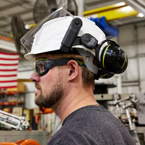 Worker wearing MX350 Clear Anti Fog Safety Eyewear with gas resistant neoprene strap and brow guard, in an industrial setting.