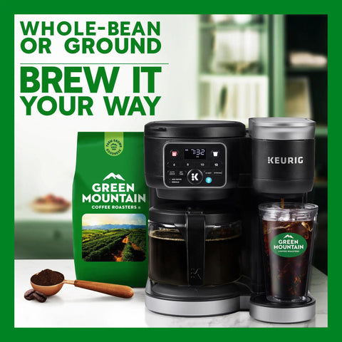 Green Mountain Coffee bag next to a Keurig coffee maker and glass of iced coffee on a kitchen counter.