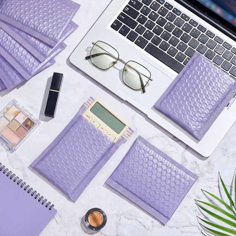100 Count Bubble Mailer Set Four Sizes Self Adhesive Waterproof Padded Envelopes For Shipping with laptop and glasses