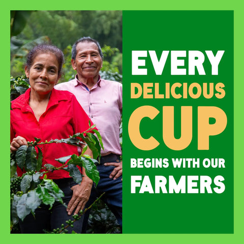 Two farmers standing in coffee field with 'Every Delicious Cup Begins With Our Farmers' text on the right side