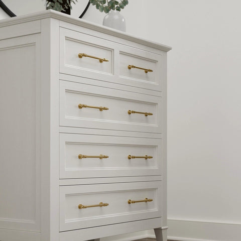 White dresser with Adjustable Drawer Pulls 5 Pack in Champagne Bronze with Fluted Edge for kitchen cabinets and furniture.
