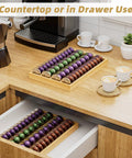 Bamboo Coffee Pod Drawer Organizer For Nespresso Vertuo Vertuoline Pods on countertop and in drawer, bamboo material