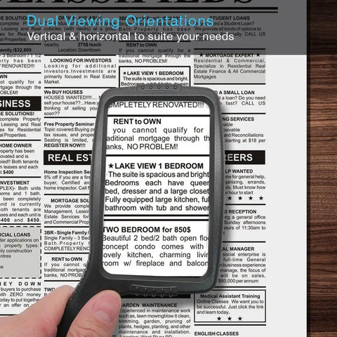 Big Ol Jumbo Size Magnifying Glass With Wide Horizontal Lens 3X Magnification shows newspaper text under lens.