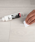 Applying Quick Fix Putty For Wood Laminate And Vinyl Floors Acrylic Based Gap Filler In White on vinyl floor
