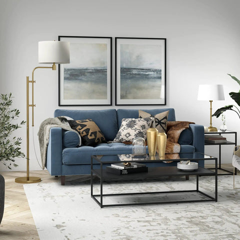Height Adjustable Floor Lamp With Dope Fabric Drum Shade In Brass White Finish next to a blue sofa in living room setting