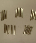 Curved Stainless Steel Shim Set 0.0015 Inch Thick LSMOV25, 25 units laid out for precision pin spacing.